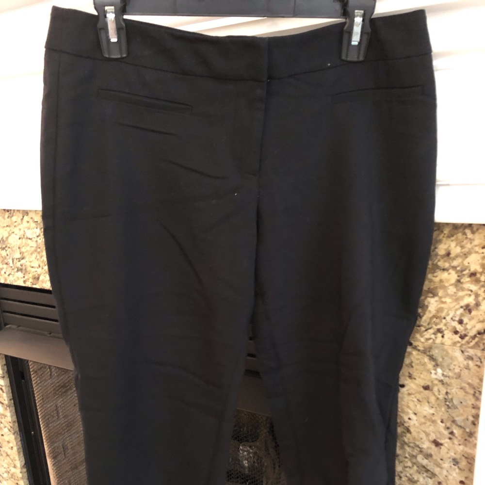 Women’s black slacks.